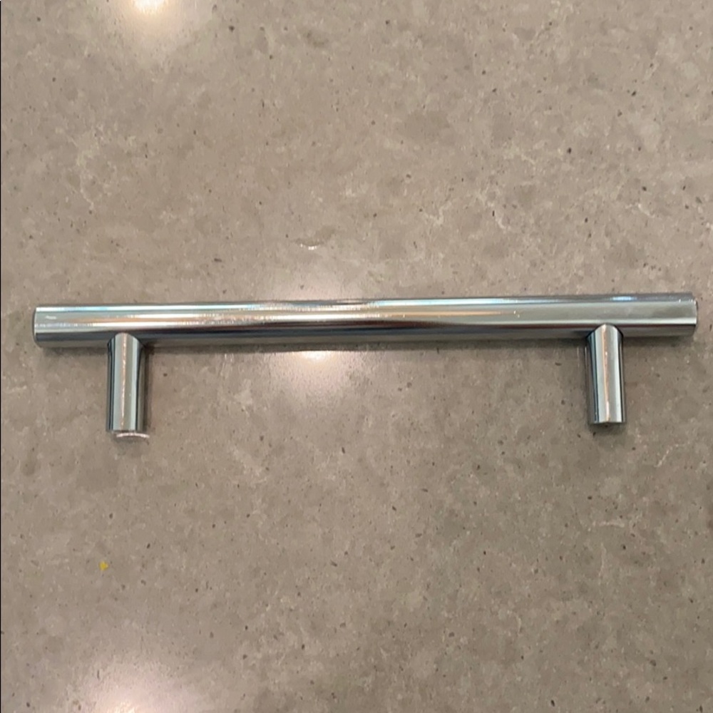 Chrome pulls. 5 1/16 inch gap. Set of 10
